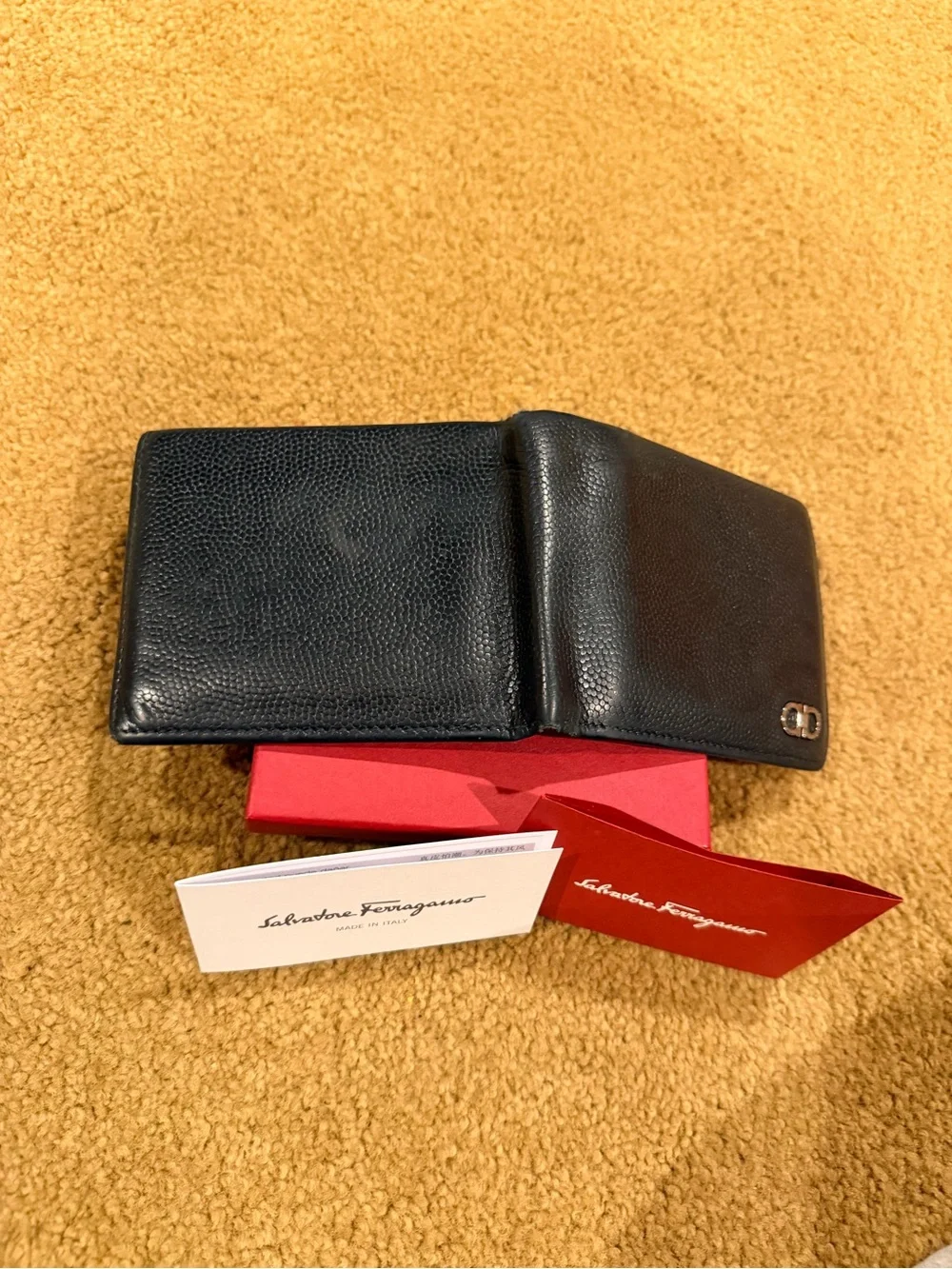 Salvatore Ferragamo Black Pebbled Leather Bi-Fold Wallet with Metal Logo